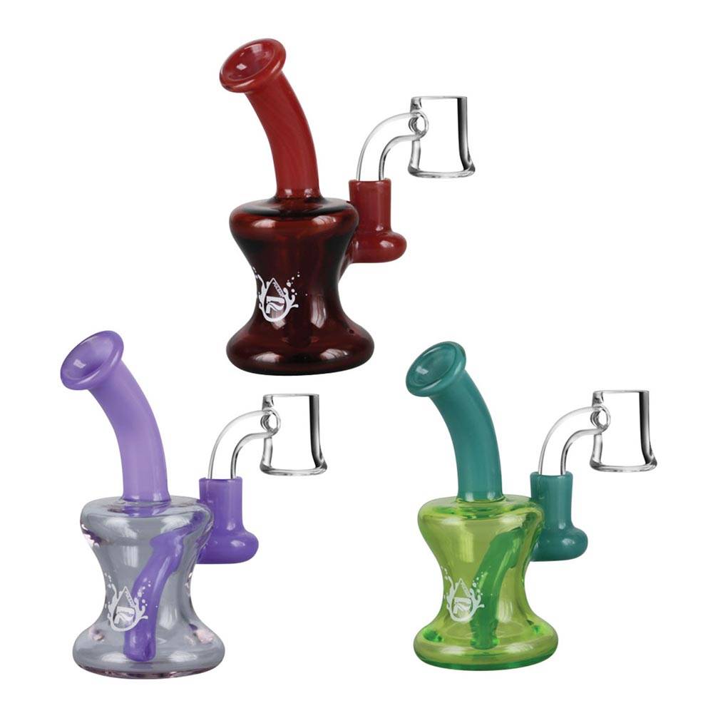 These Pulsar mini travel rigs stand 4" tall and features a fixed diffused downstem. These fun colourful mix-matched dab rigs are sold in assorted colours and includes a 10mm male quartz banger.  Customers can make this a perfect dabbing setup by adding a carb cap and dab