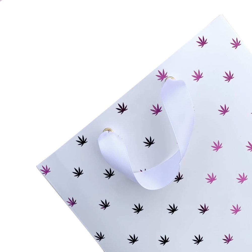 Cannabis Themed Gift Bags The New Polka Dot gift bag by KushKards features a green pot leaf pattern and a white ribbon handle to customize your gift wrapping.