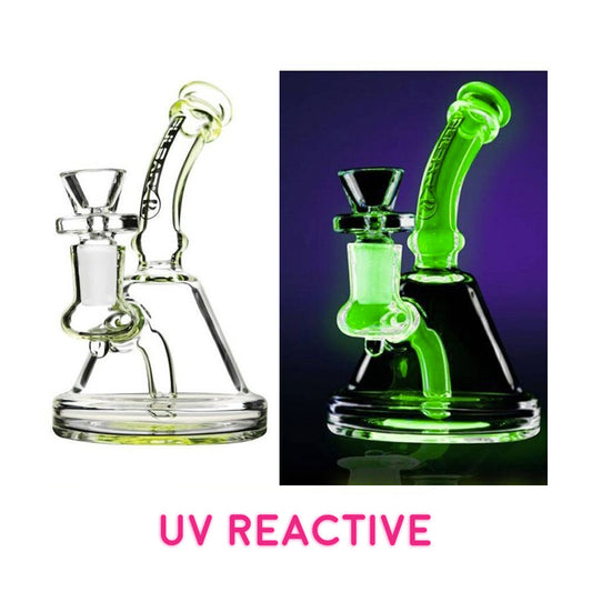 The 5" UV Water Pipe features colored highlights that glow warmly under black light, a fixed downstem & 14mm female joint. Handled glass herb slide included.  Turn off the lights, reach for your Black Light get ready to see your UV Reactive Glass glow in the darkness. UV Reactive pieces are absolutely amazing and a definite conversational piece. 