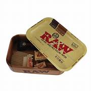 The RAW Cache Box features a storage base made of Acacia wood with a RAW rolling tray cover. The small RAW Classic Rolling Tray (which is also included) acts as a lid and fits perfectly atop the RAW Cachebox as you roll, organize and store your herbs and accessories Sesh-KanAccessories