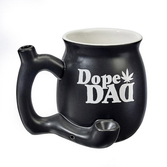 Perk up your morning routine with this fun, ceramic novelty mug that features a standard coffee cup that can hold approx. 11 oz of your favourite blend. Attached to the front of the mug is a pipe where you can pack your legal herb and light it up, the smoke filters up the hollow handle to the mouthpiece on the top. Sit back, relax and enjoy your smoke and coffee!